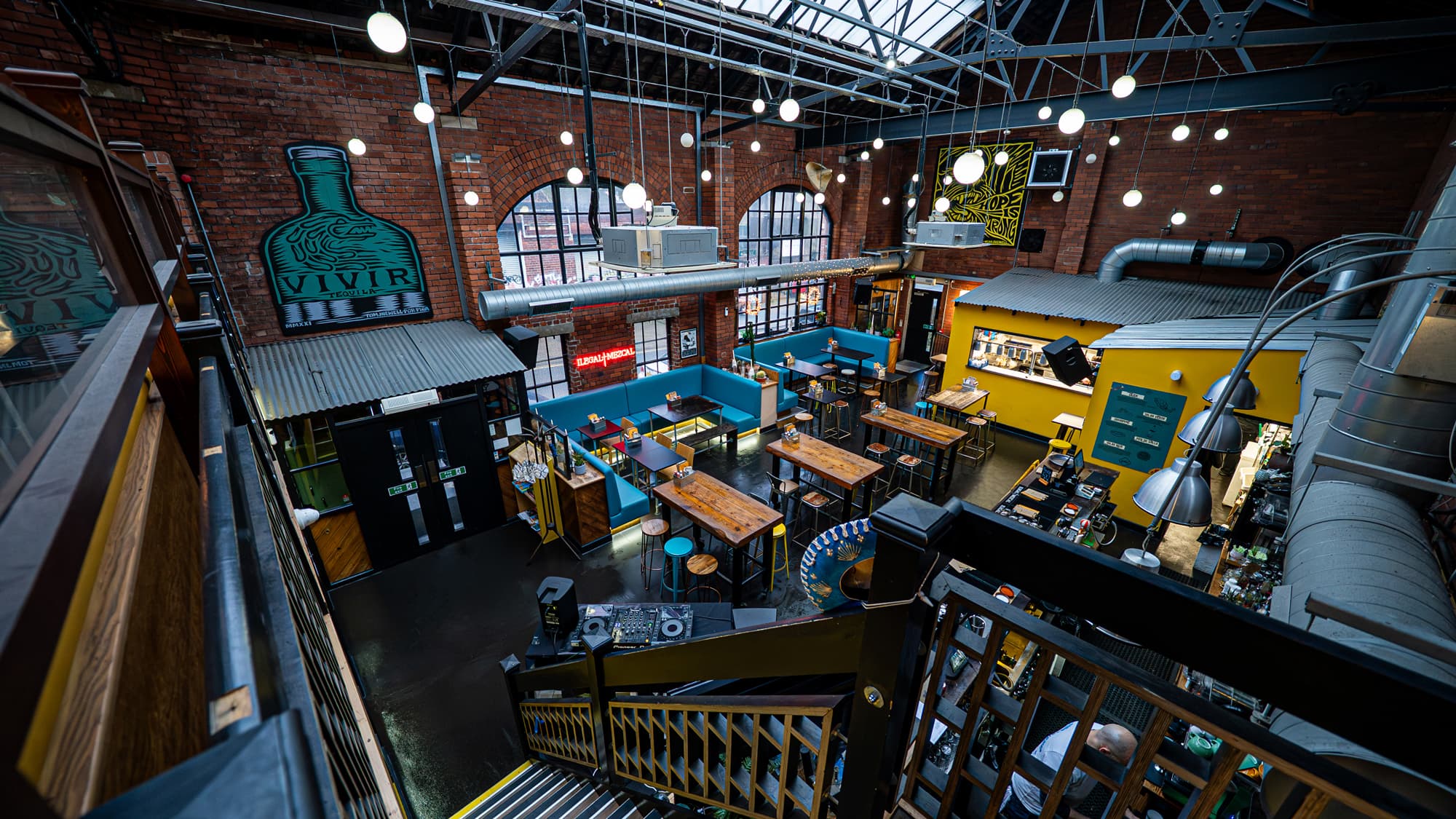 The colourful interior of Bar Piña, with its bar and mezzanine seating